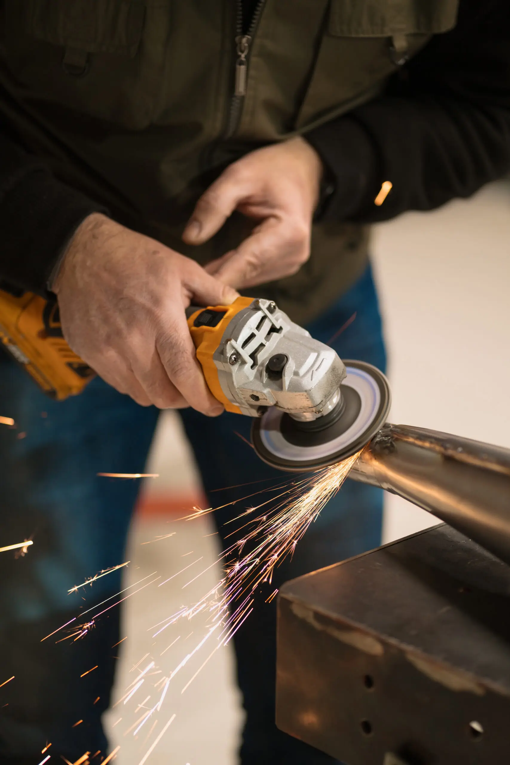 man fixing motorcycle modern workshop scaled